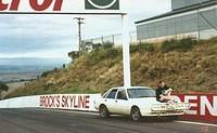 Andy on Mt Panorama, site of the race! etc. Also note car that doesn't exist anymore.