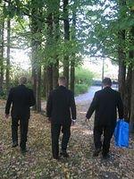 Groom, Brother in Law and Friend walk away